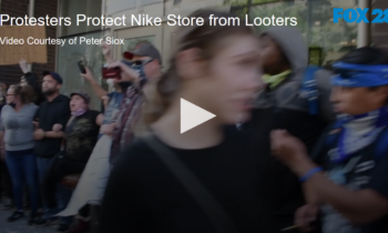 Protesters Form Human Shield at Nike Store