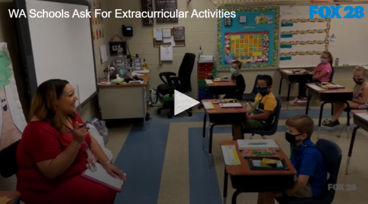 teacher in classroom with younger grade students