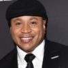 actor and music star ll cool j dressed in a black suit with a white shirt and a black tie and a black hat