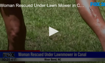 Woman Rescued Under Lawn Mower in Canal