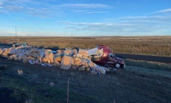 Semi-truck loaded with frozen pizzas rolled on westbound I-90 west of Ritzville