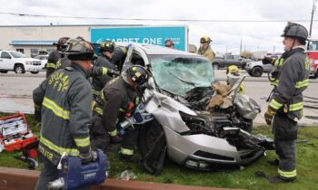 Man trapped in car after crash rescued by Spokane firefighters