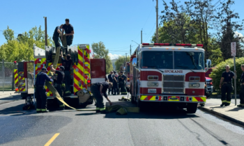 Children evacuated after car fire at Spokane business center