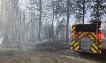 Spokane’s Grove fire containment progresses as more buildings burn