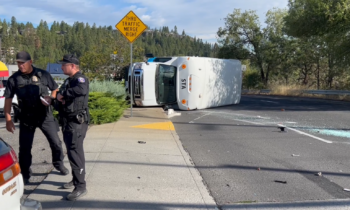 Car collides with Spokane Transit bus blocking traffic