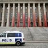 Environmentalists smear Finland’s parliament in red paint