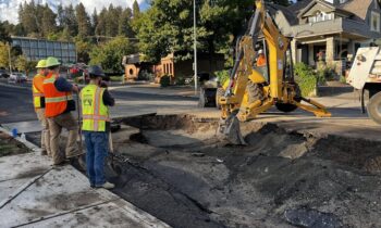 Washington Street closed due to water main break causing flooding