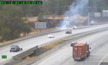 Firefighters battle small blaze near I-90 in Spokane