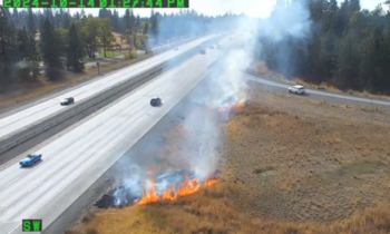 Brush fire burns alongside I-90 near Spokane airport