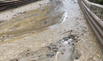 Sudden waterflow over Highway 31 near Metaline Falls due to water main break