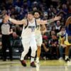 Doncic triple-double leads Mavs over Warriors in record duel